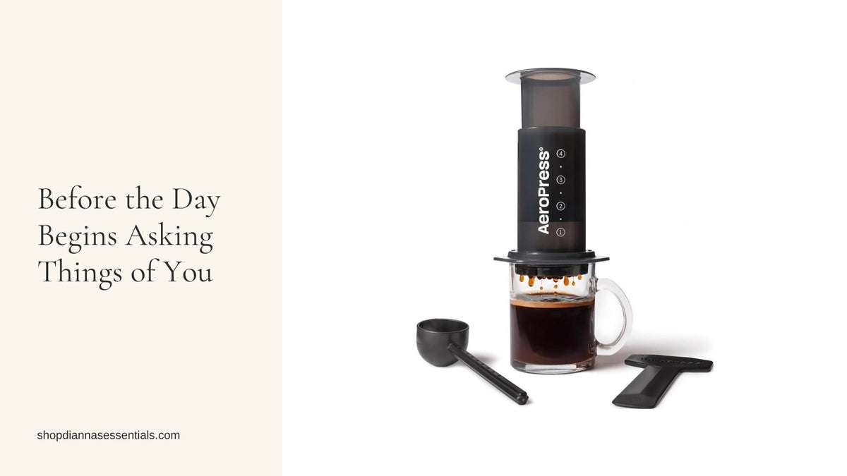 AeroPress Original coffee press brewing fresh coffee into a glass mug