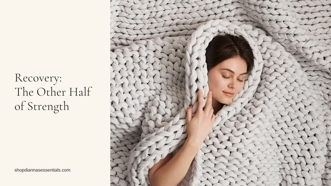 Woman resting with eyes closed, wrapped in a light grey Bearaby Napper hand-knit cotton weighted blanket