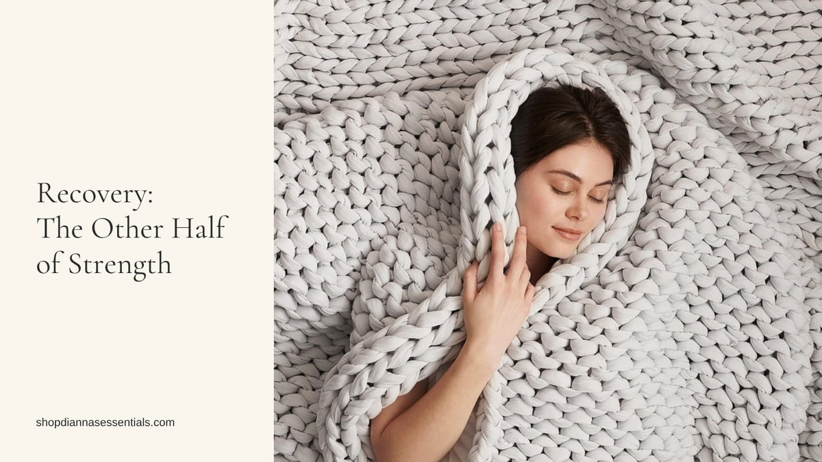 Woman resting with eyes closed, wrapped in a light grey Bearaby Napper hand-knit cotton weighted blanket