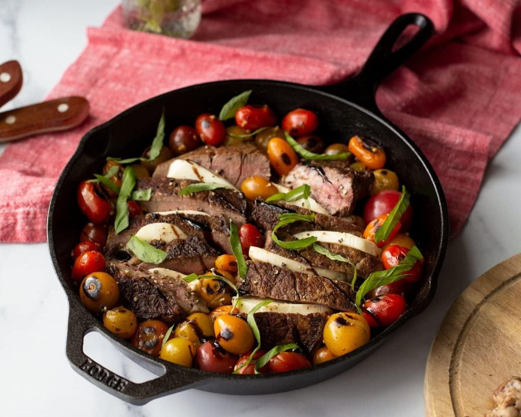 Steak and roasted vegetables cooked in a Lodge Cast-Iron Skillet