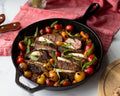 Steak and roasted vegetables cooked in a Lodge Cast-Iron Skillet