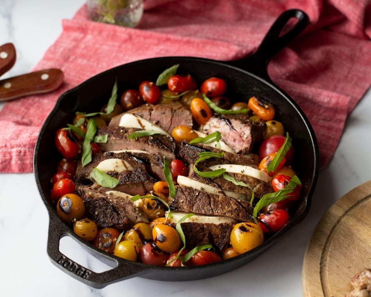Steak and roasted vegetables cooked in a Lodge Cast-Iron Skillet