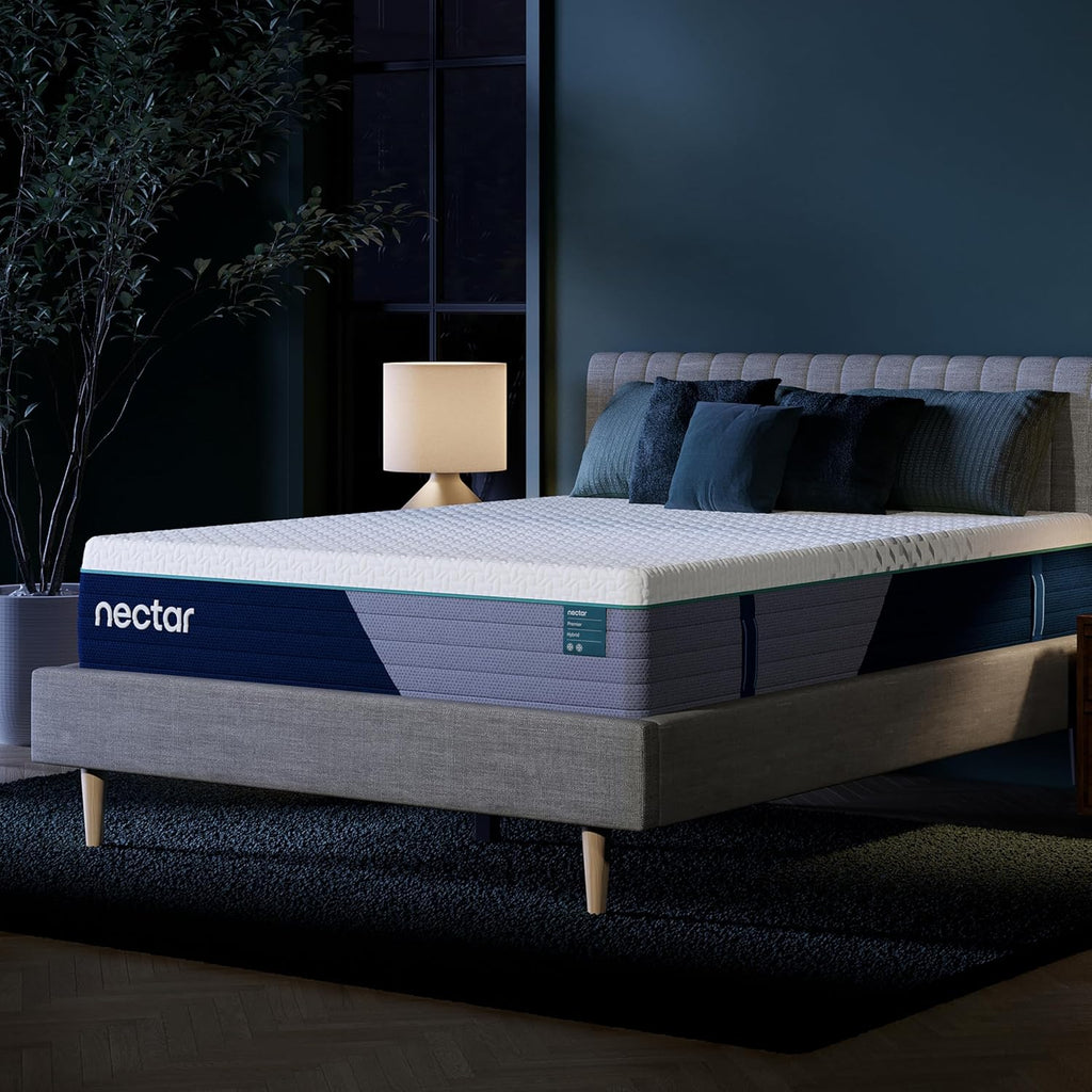 Nectar Luxe Hybrid Mattress on a bed in a dark bedroom setting