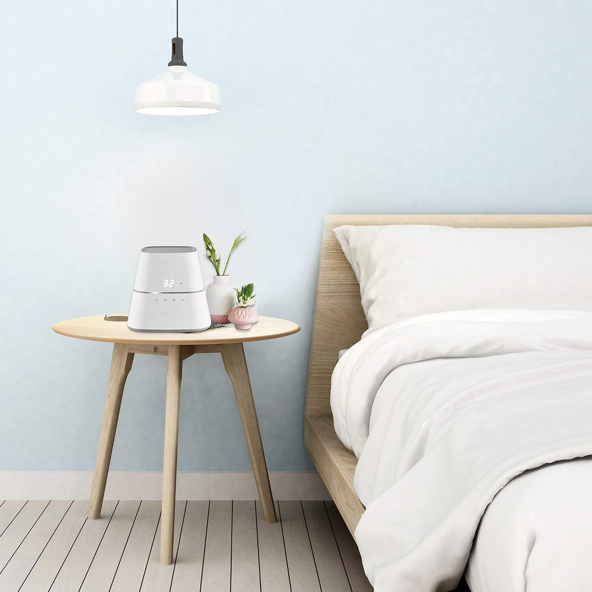 AquaPad CozyFlow Water Heated Mattress Pad on a bed in a bright bedroom