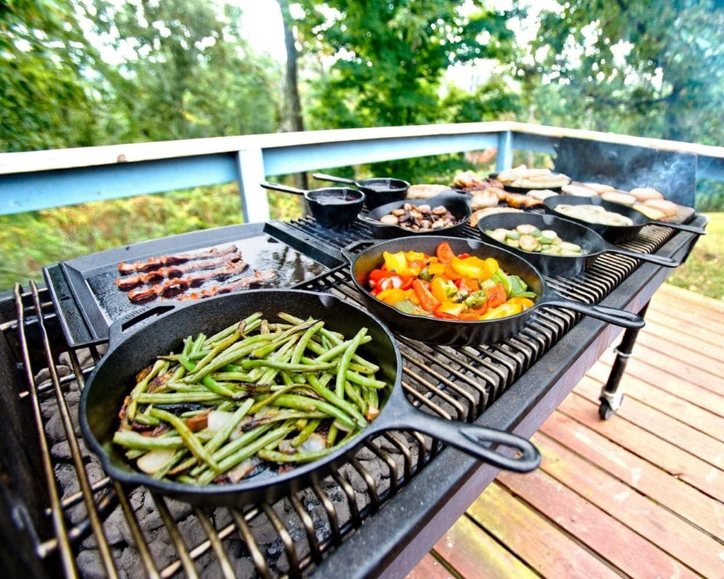 Lodge Cast-Iron Skillet with grilled vegetables, set outdoors on a table