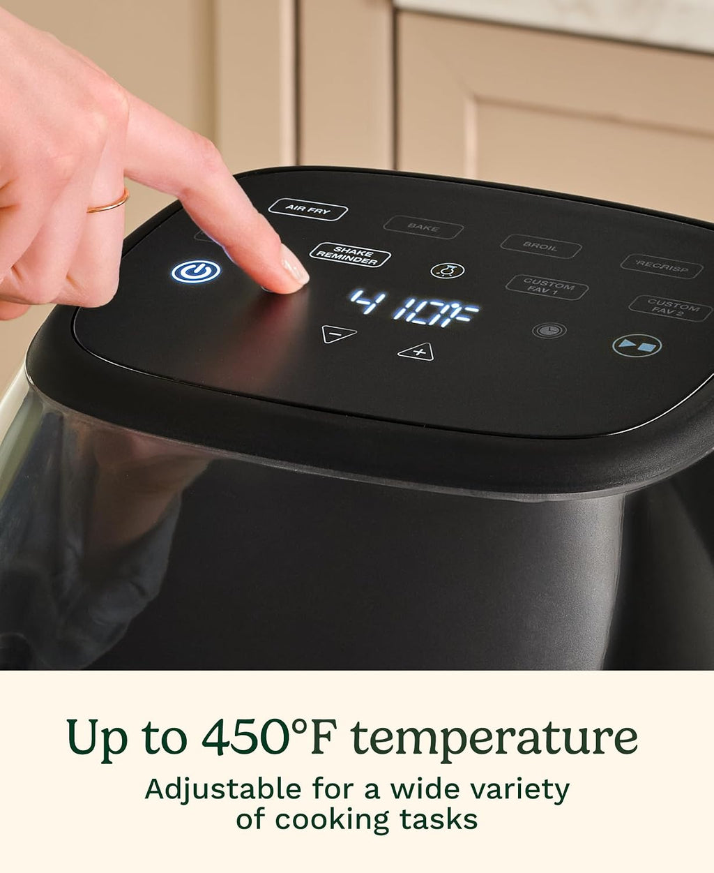Close-up of a finger pressing the Cuisinart Air Fryer's digital control panel