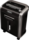 Fellowes Powershred 79Ci shredder, front view showing paper feed slot, control panel, and pull-out bin with shredded paper visible