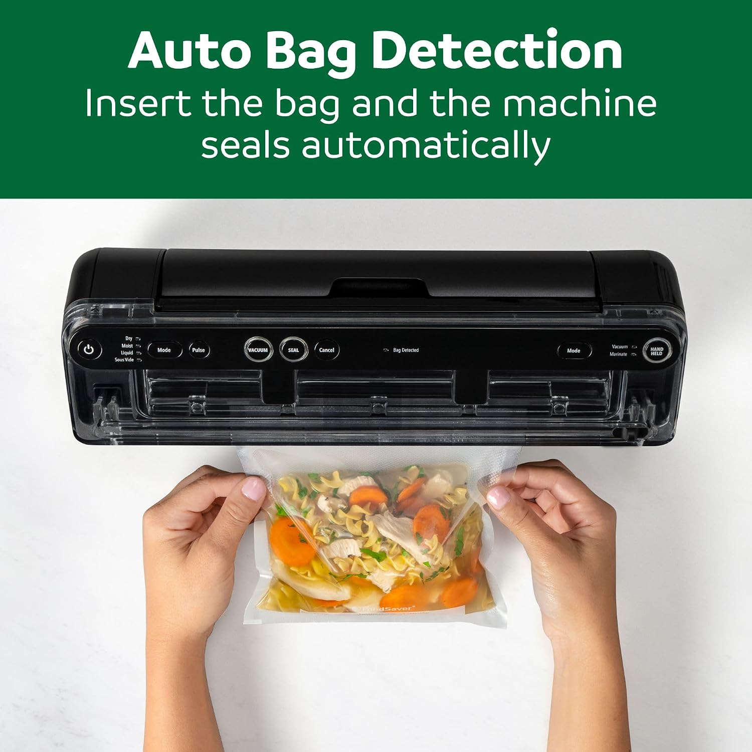 Overhead view of hands feeding a bag of noodle soup into the FoodSaver Elite, text reads Auto Bag Detection