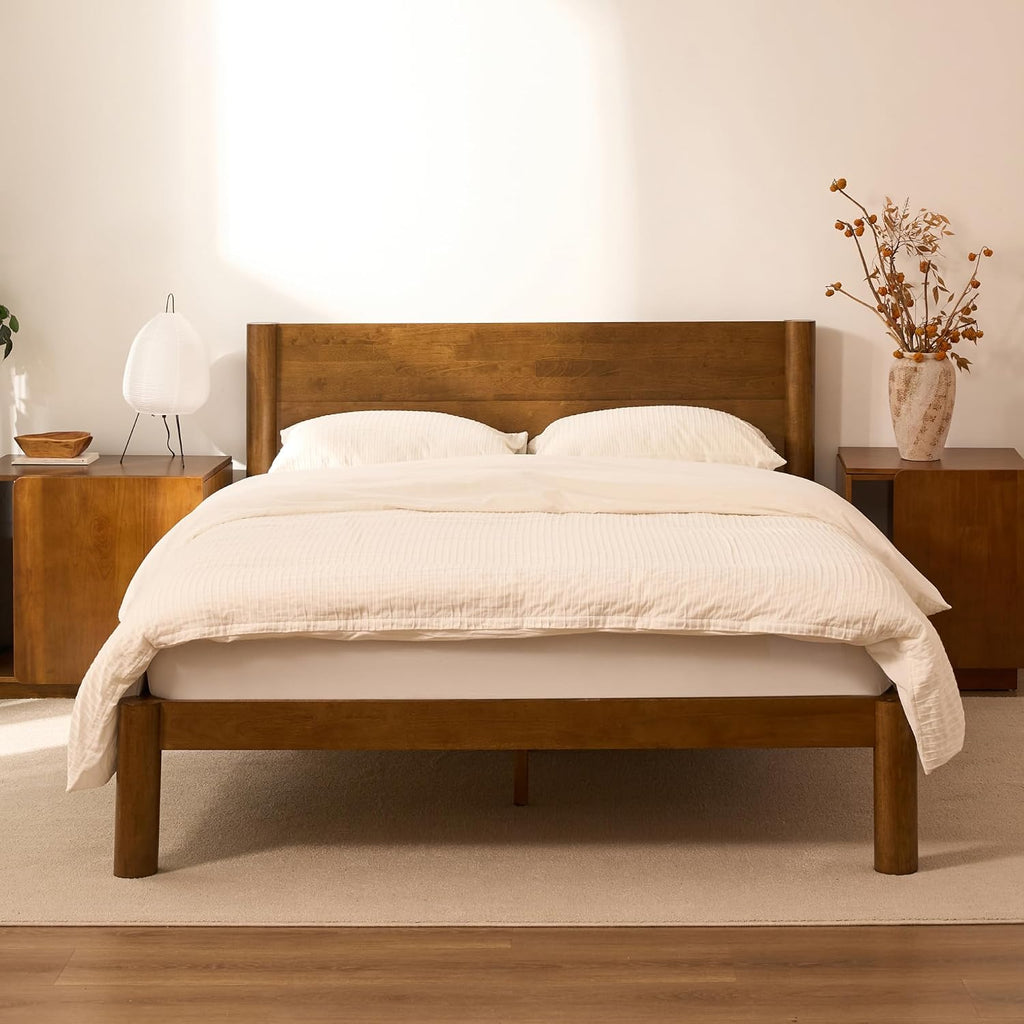 FLEXISPOT Hako G2 Japanese Joinery Bed Frame in walnut with a white bedding set, styled in a warm bedroom with matching nightstands