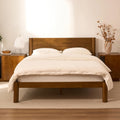 FLEXISPOT Hako G2 Japanese Joinery Bed Frame in walnut with a white bedding set, styled in a warm bedroom with matching nightstands