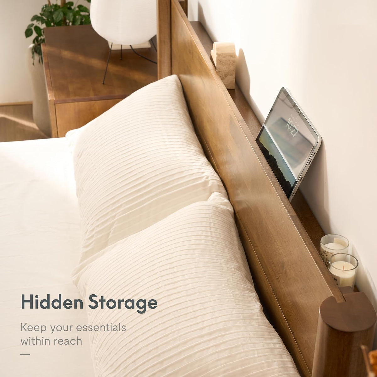 Close-up of the FLEXISPOT Hako G2 bed frame's headboard shelf holding a tablet and candles, text reads Hidden Storage