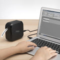 Brother P-touch CUBE Plus Label Maker on a desk next to a laptop