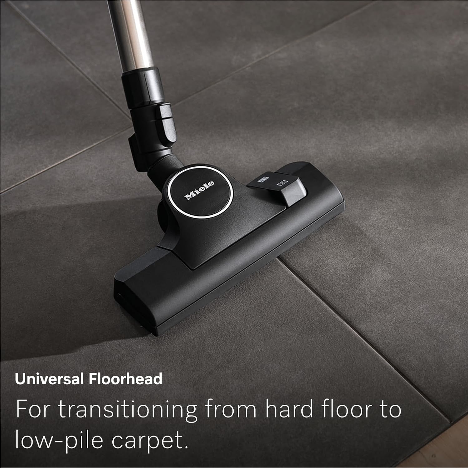 Miele Guard L1's Universal Floorhead transitioning from hard floor to low-pile carpet