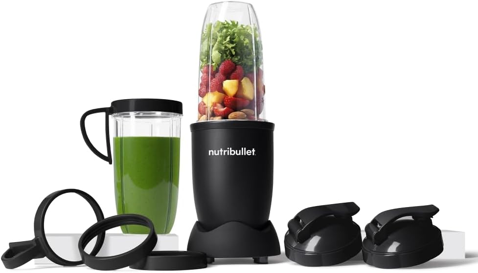 NutriBullet Special Edition Pro 900 set with motor base, cup filled with fruit and greens, finished green smoothie in a to-go mug, and flip-top lids