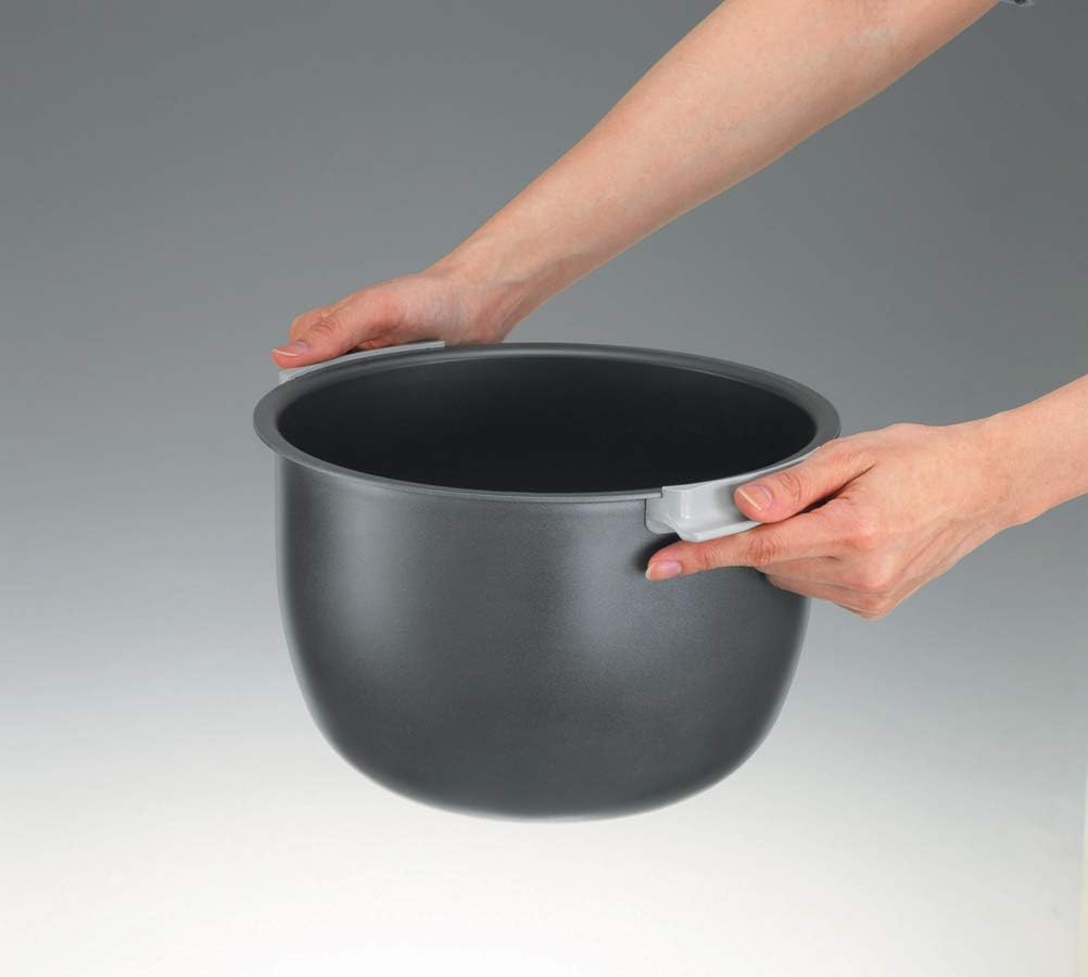 Hand holding the removable nonstick inner cooking pan from the Zojirushi Neuro Fuzzy Rice Cooker