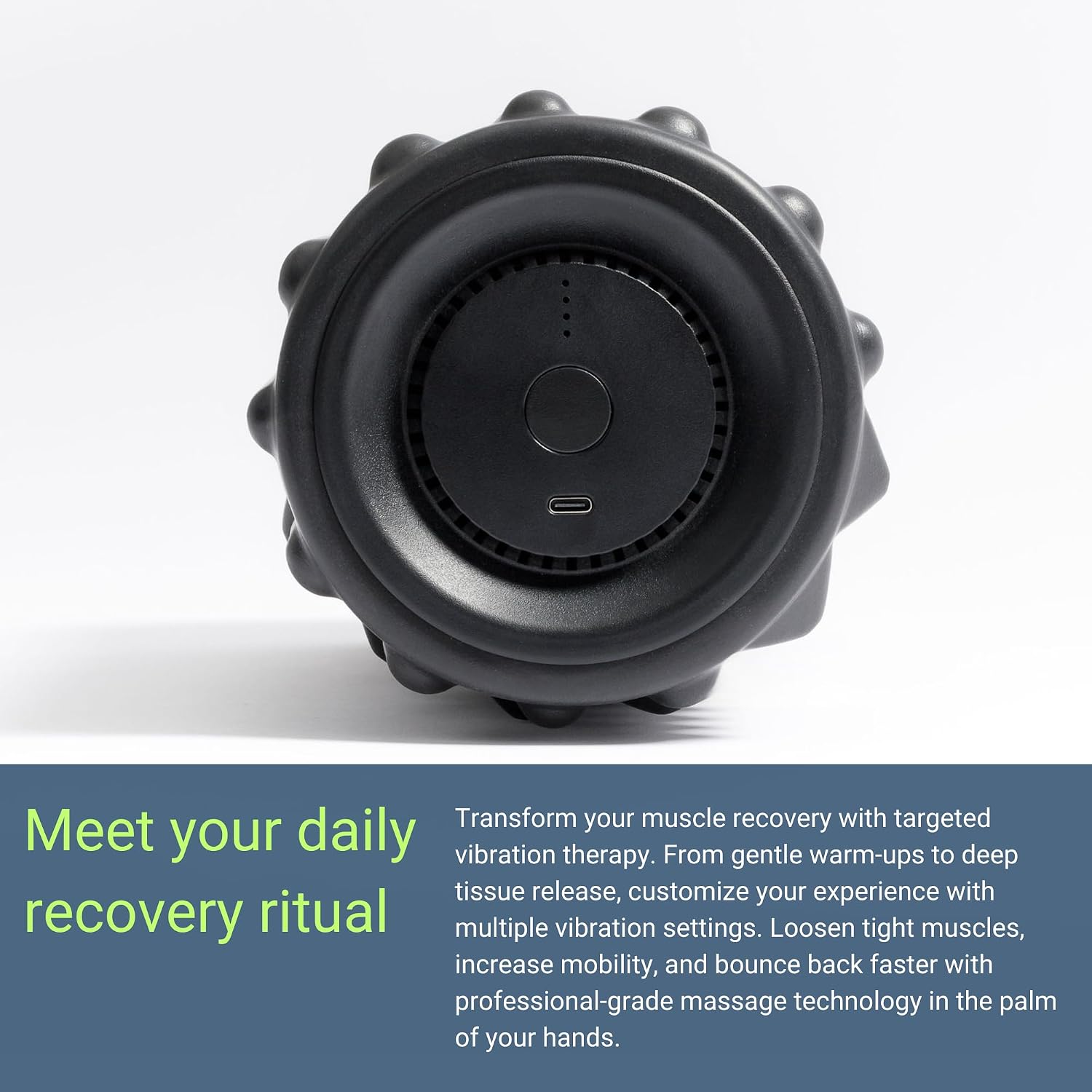 Close-up of the VibePro Flow vibrating foam roller's control button and charging port