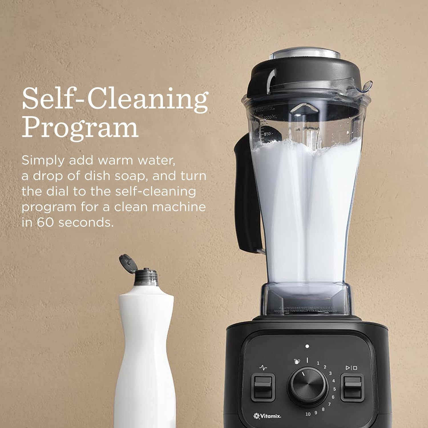 Vitamix VX1 blender running its self-cleaning program with warm water and dish soap