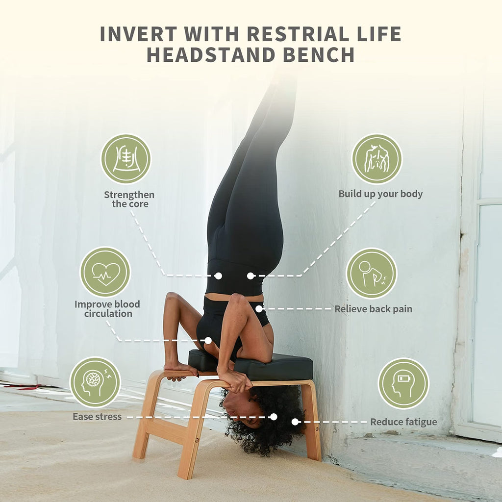 Person doing a full inversion on the Restrial Life wooden yoga headstand bench
