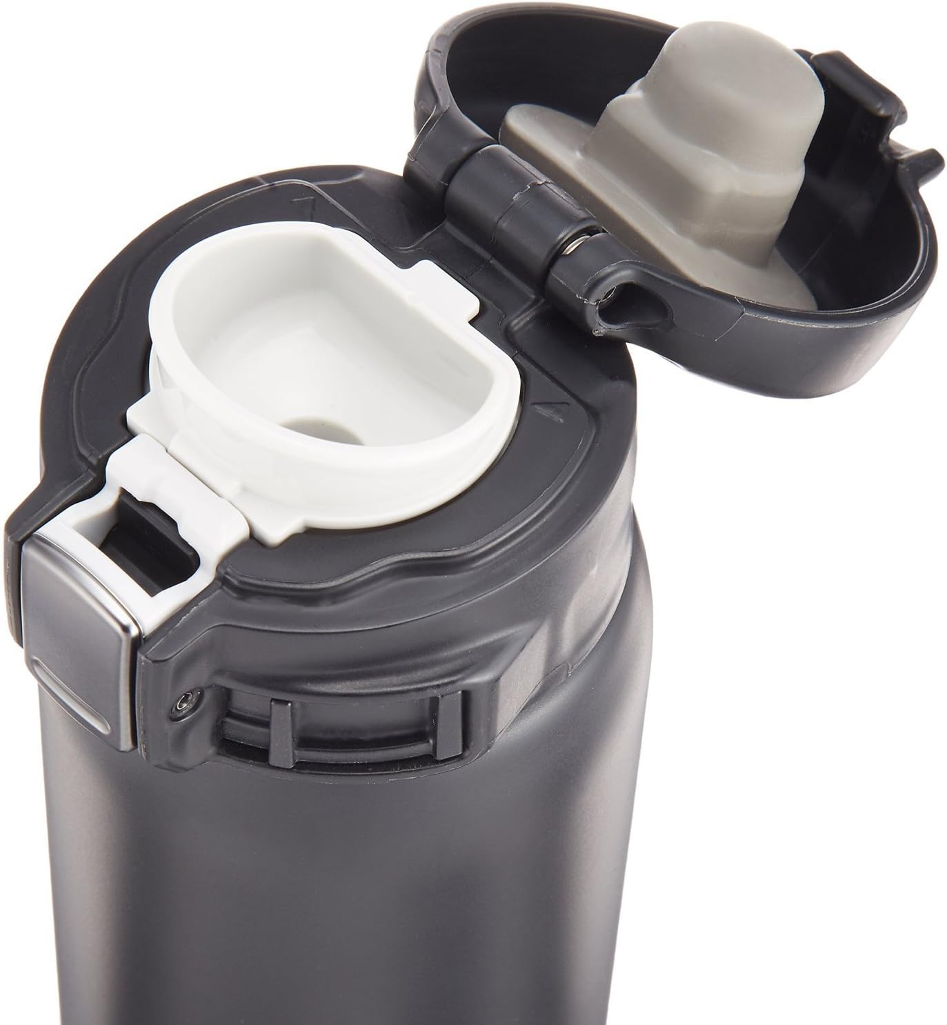 Close-up of the Zojirushi Stainless Steel Travel Mug's flip-top lid open, showing the drink spout