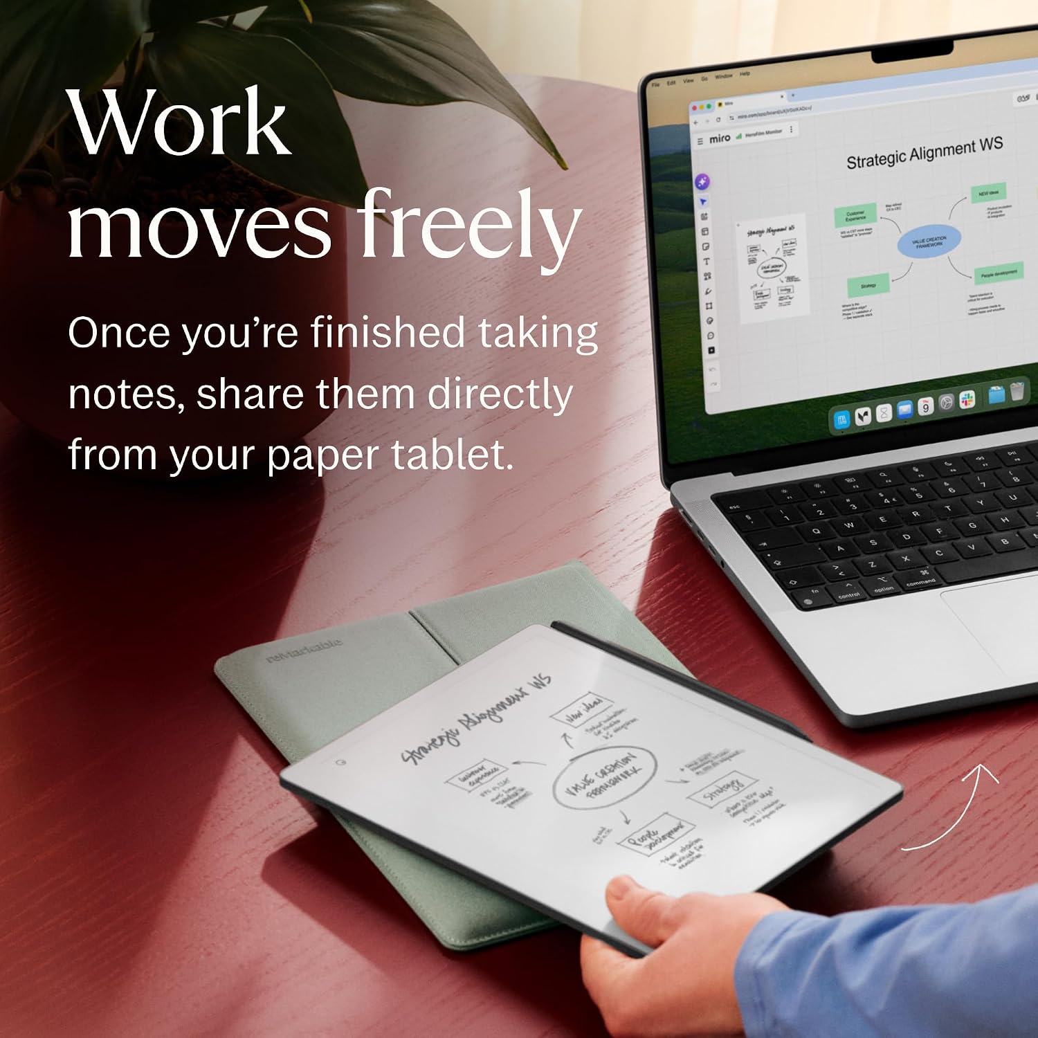 reMarkable Paper Pure tablet with a hand-drawn mind map resting on a desk beside an open laptop showing the same diagram digitally, text reads Work moves freely, once you're finished taking notes, share them directly from your paper tablet